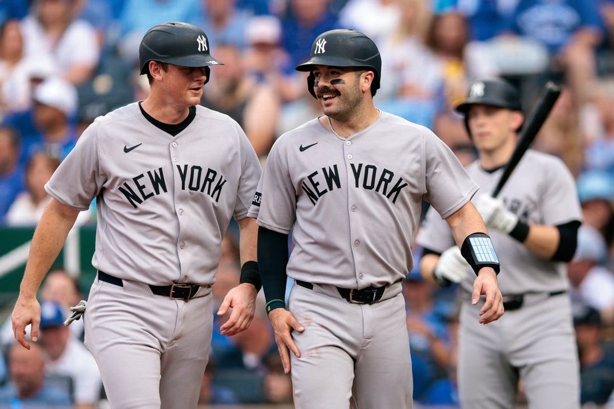 Jun 11, 2025; Kansas City, Missouri, USA; New York Yankees second base DJ LeMahieu (26) and New York Yankees catcher Austin Wells (28) celebrate after scoring during the second inning against the Kansas City Royals  at Kauffman Stadium. Mandatory Credit: William Purnell-Imagn Images