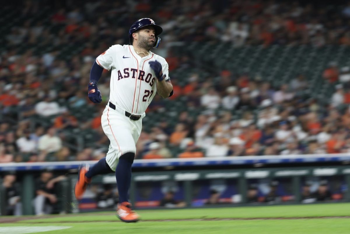 Jun 11, 2025; Houston, Texas, USA; Houston Astros second baseman Jose Altuve (27) hits a single and runs down the first base line against the Chicago White Sox in the third inning at Daikin Park. Mandatory Credit: Thomas Shea-Imagn Images