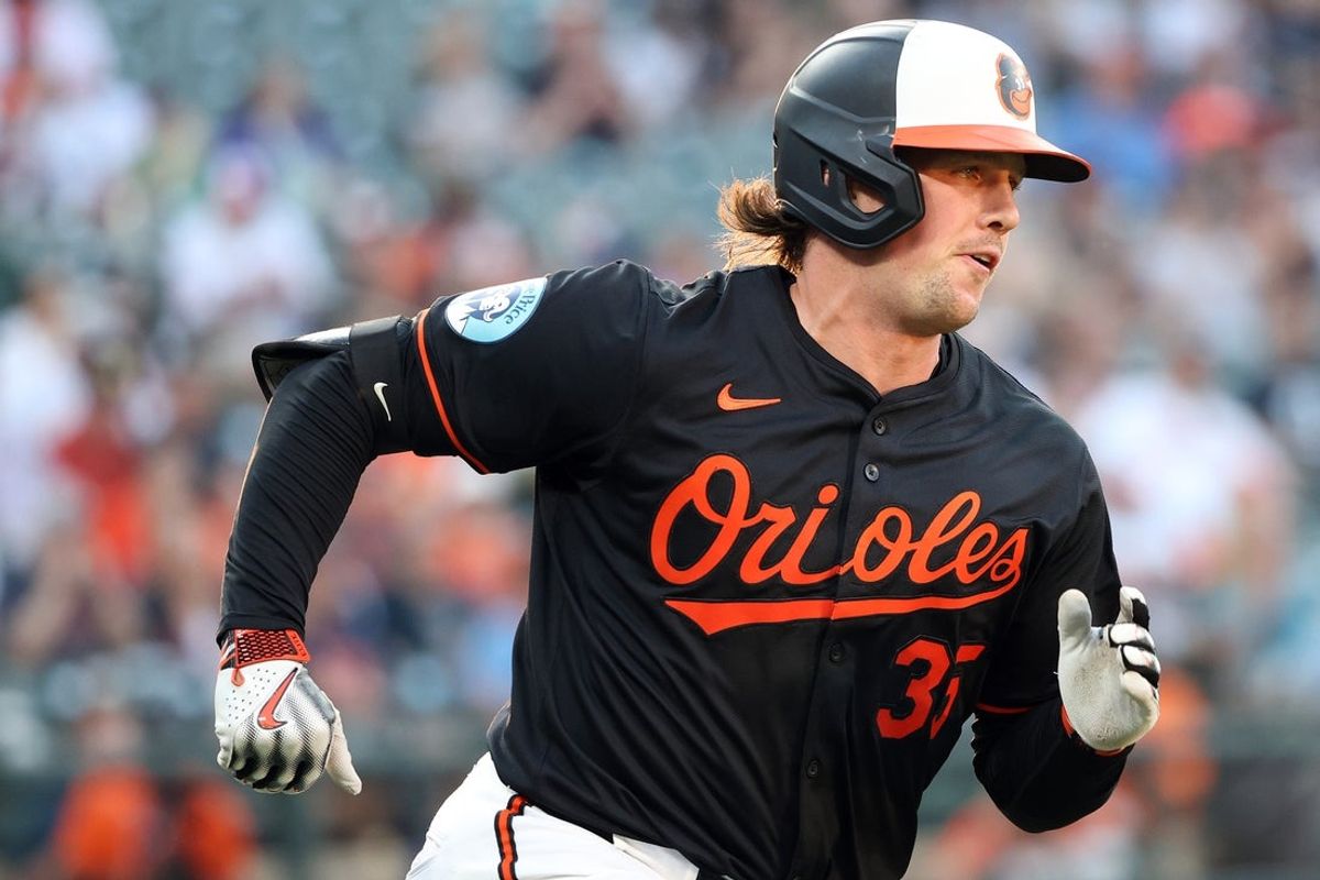 Jun 11, 2025; Baltimore, Maryland, USA; Baltimore Orioles catcher Adley Rutschman (35) hits a single during the fifth inning against the Detroit Tigers at Oriole Park at Camden Yards. Mandatory Credit: Daniel Kucin Jr.-Imagn Images