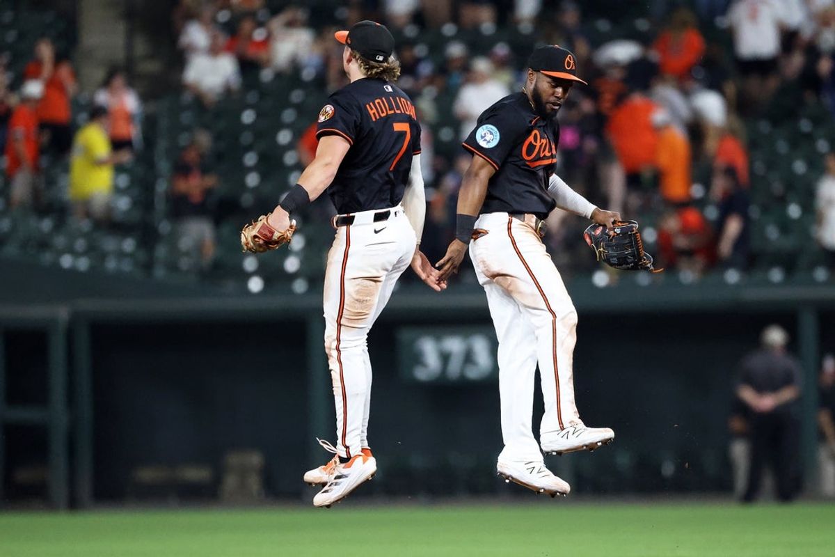 Jun 11, 2025; Baltimore, Maryland, USA; Baltimore Orioles second baseman Jackson Holliday (7) and Baltimore Orioles outfielder Cedric Mullins (31) celebrate after a game against the Detroit Tigers at Oriole Park at Camden Yards. Mandatory Credit: Daniel Kucin Jr.-Imagn Images