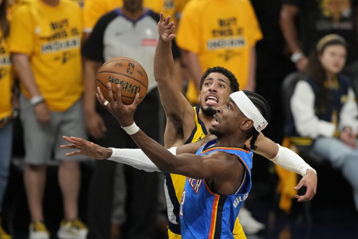 Jun 11, 2025; Indianapolis, Indiana, USA; Oklahoma City Thunder guard Shai Gilgeous-Alexander (2) shoots the ball against Indiana Pacers guard Tyrese Haliburton (0) during the first half during game three of the 2025 NBA Finals at Gainbridge Fieldhouse. Mandatory Credit: Kyle Terada-Imagn Images