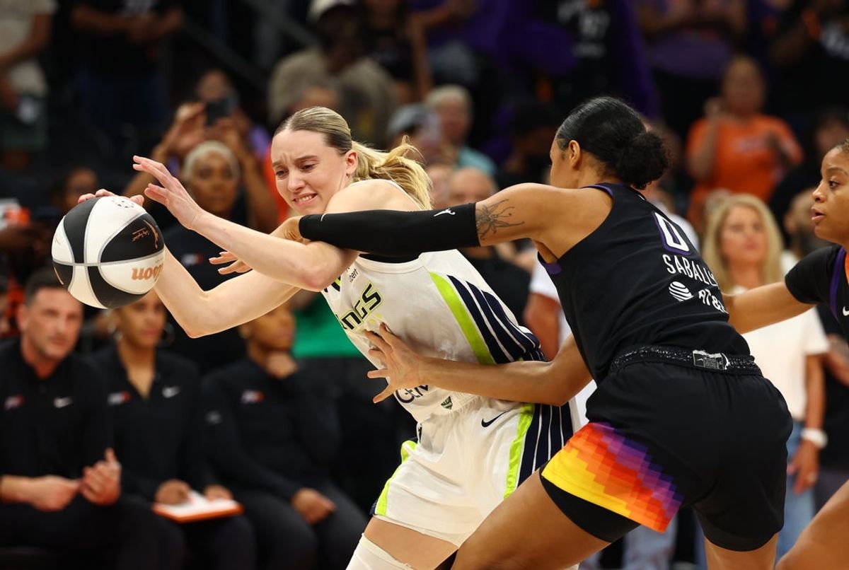 Jun 11, 2025; Phoenix, Arizona, USA; Dallas Wings guard Paige Bueckers (5) against Phoenix Mercury forward Satou Sabally (0) in the first half at PHX Arena. Mandatory Credit: Mark J. Rebilas-Imagn Images