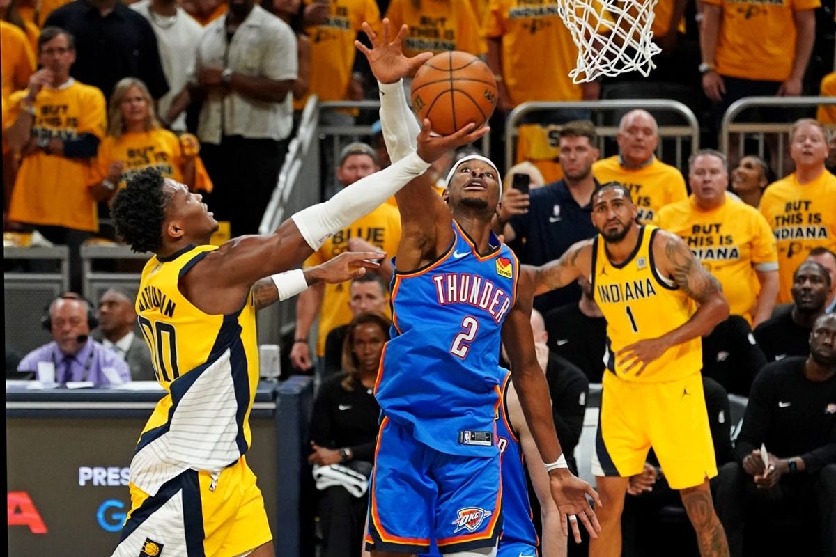 Jun 11, 2025; Indianapolis, Indiana, USA; Indiana Pacers guard Bennedict Mathurin (00) shoots the ball against Oklahoma City Thunder guard Shai Gilgeous-Alexander (2) in game three of the 2025 NBA Finals at Gainbridge Fieldhouse. Mandatory Credit: Kyle Terada-Imagn Images