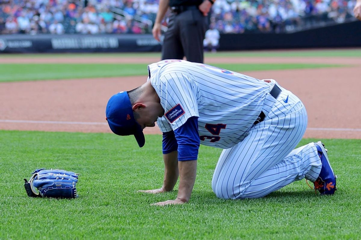 Jun 12, 2025; New York City, New York, USA; New York Mets starting pitcher Kodai Senga (34) reacts after sustaining an injury during the sixth inning against the Washington Nationals at Citi Field. Mandatory Credit: Brad Penner-Imagn Images