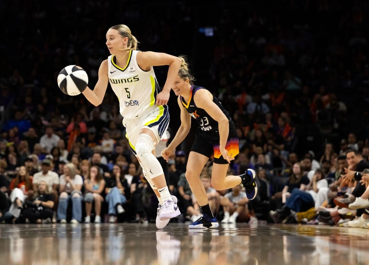 Jun 11, 2025; Phoenix, Arizona, USA; Dallas Wings guard Paige Bueckers (5) against the Phoenix Mercury at PHX Arena. Mandatory Credit: Mark J. Rebilas-Imagn Images