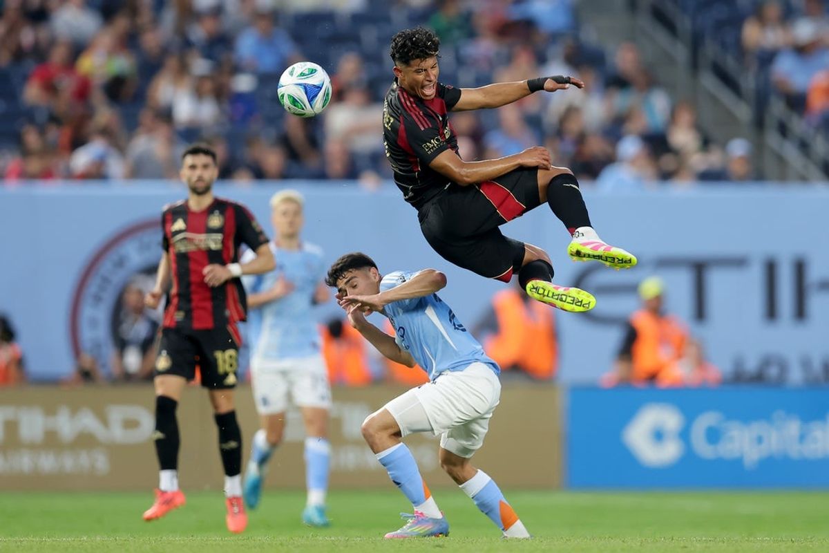 Jun 12, 2025; New York, New York, USA; Atlanta United defender Ronald Hernandez (2) and New York City FC forward Agustin Ojeda (26) fight for a header during the first half at Yankee Stadium. Mandatory Credit: Brad Penner-Imagn Images