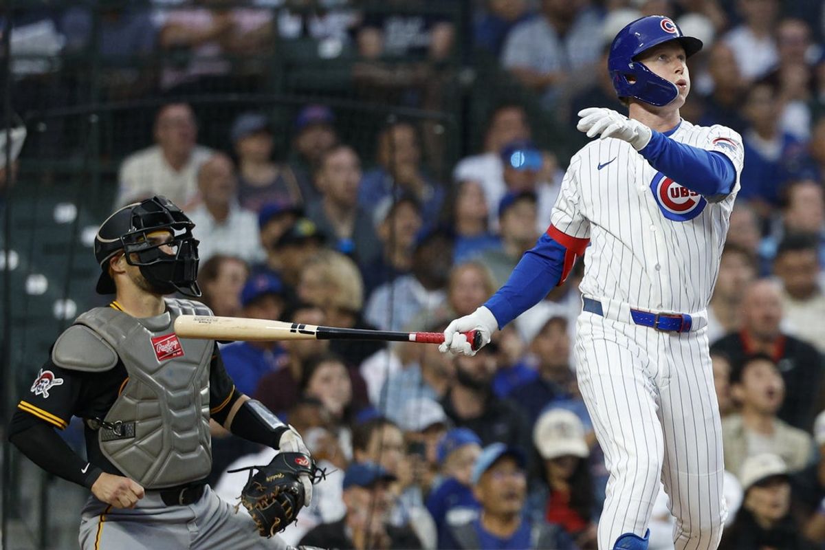 Jun 12, 2025; Chicago, Illinois, USA; Chicago Cubs center fielder Pete Crow-Armstrong (4) hits a two-run home run against the Pittsburgh Pirates during the fourth inning at Wrigley Field. Mandatory Credit: Kamil Krzaczynski-Imagn Images