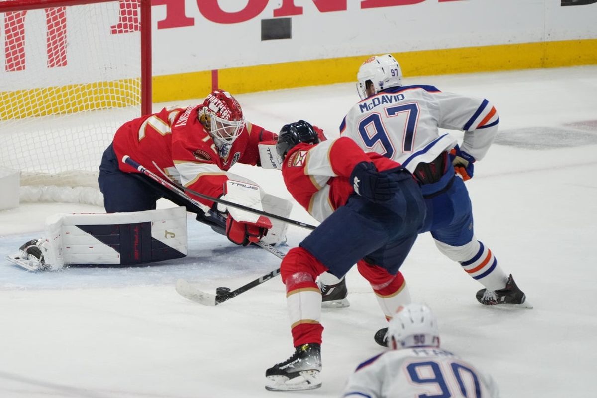 Jun 12, 2025; Sunrise, Florida, USA; Florida Panthers goaltender Sergei Bobrovsky (72) defends against Edmonton Oilers center Connor McDavid (97) during the second period in game four of the 2025 Stanley Cup Final at Amerant Bank Arena. Mandatory Credit: Jim Rassol-Imagn Images