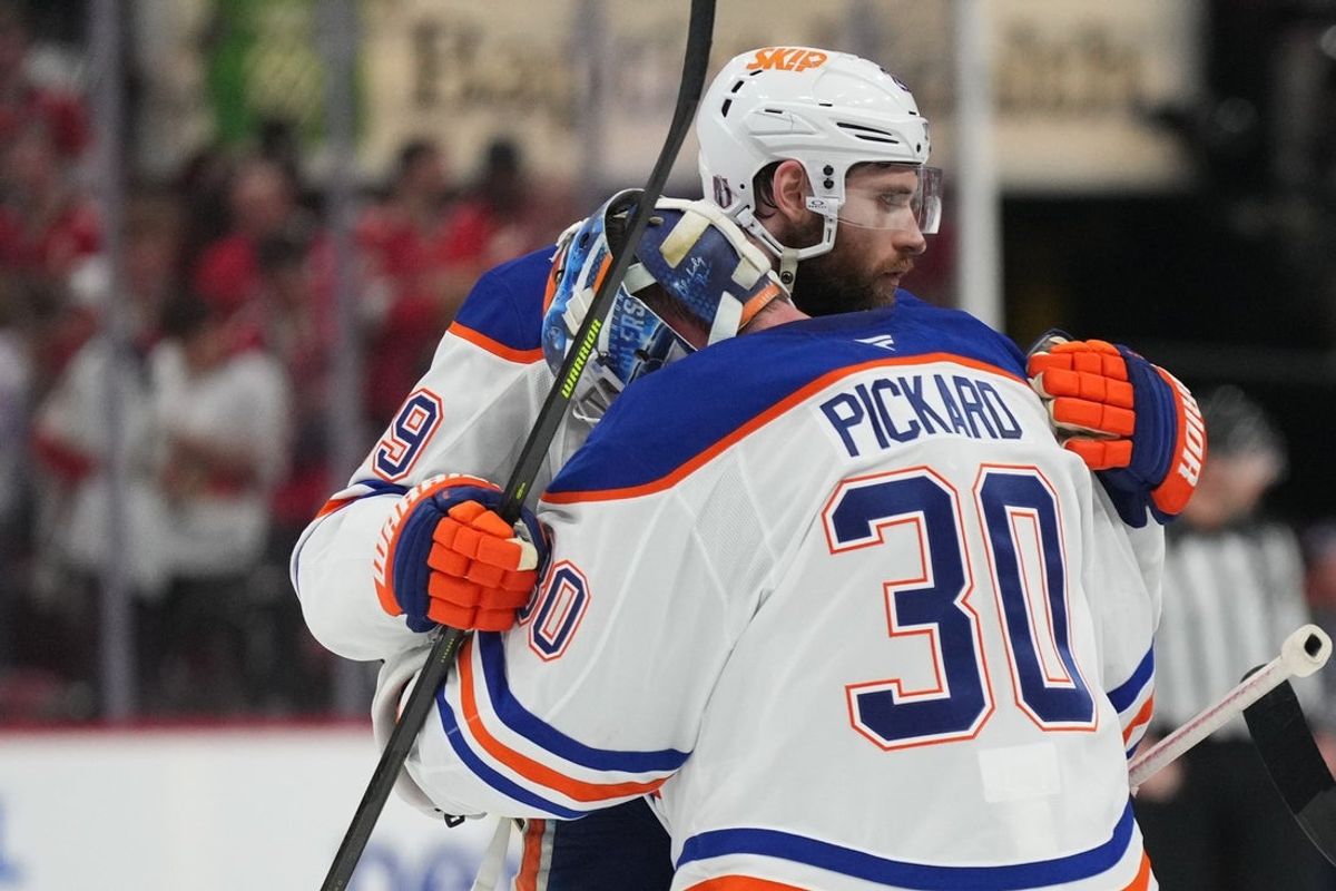 Jun 12, 2025; Sunrise, Florida, USA; Edmonton Oilers center Leon Draisaitl (29) celebrates the win with goaltender Calvin Pickard (30) after overtime against the Florida Panthers in game four of the 2025 Stanley Cup Final at Amerant Bank Arena. Mandatory Credit: Jim Rassol-Imagn Images