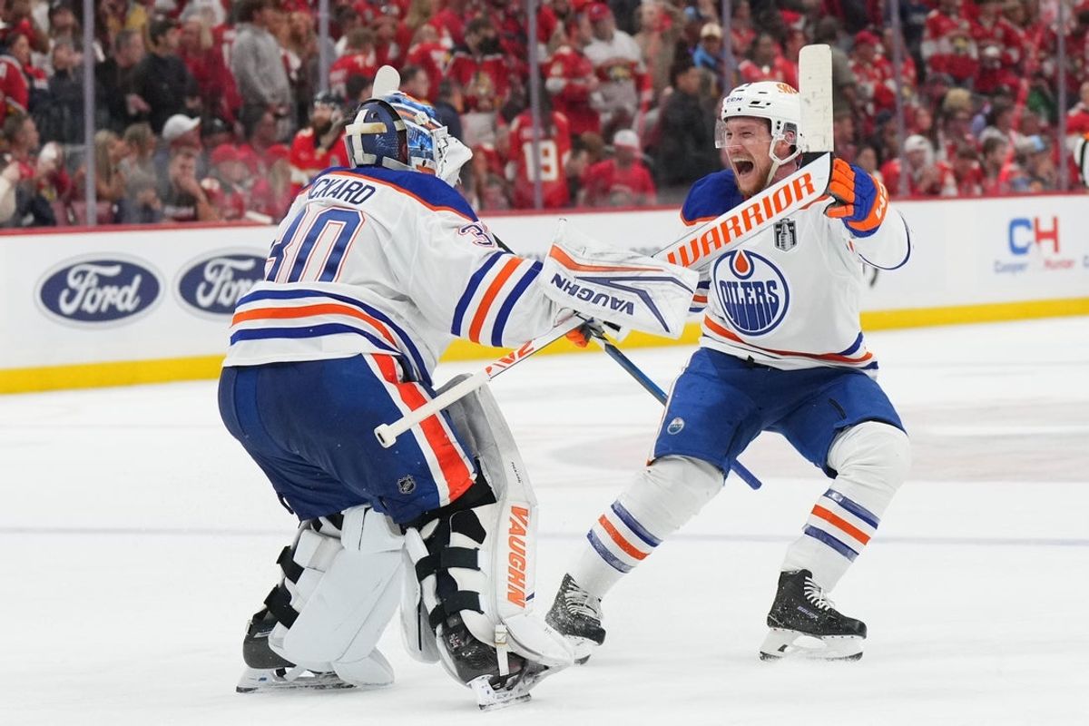 Jun 12, 2025; Sunrise, Florida, USA; Edmonton Oilers goaltender Calvin Pickard (30) celebrates with center Jeff Skinner (53) after the win in overtime against the Florida Panthers in game four of the 2025 Stanley Cup Final at Amerant Bank Arena. Mandatory Credit: Jim Rassol-Imagn Images