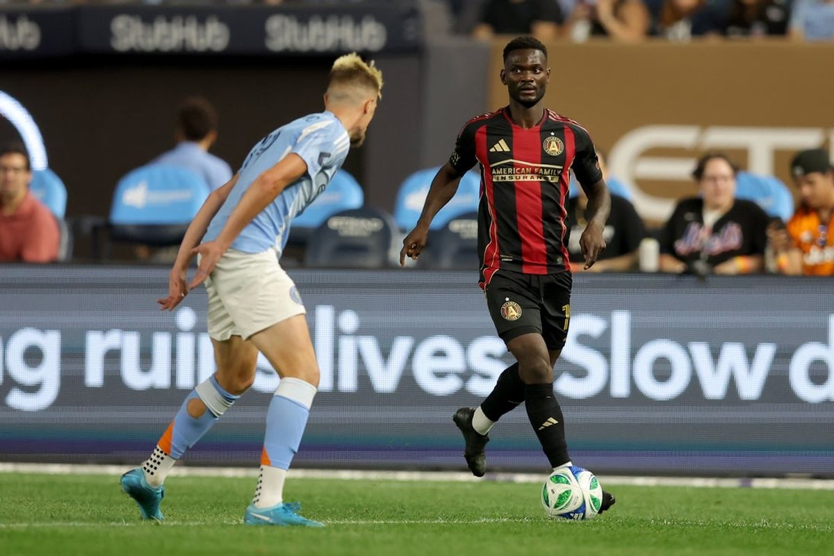 Jun 12, 2025; New York, New York, USA; Atlanta United forward Emmanuel Latte Lath (19) brings the ball up the pitch against New York City FC defender Strahinja Tanasijevic (19) during the second half at Yankee Stadium. Mandatory Credit: Brad Penner-Imagn Images