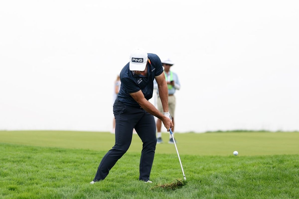 Jun 13, 2025; Oakmont, Pennsylvania, USA; Viktor Hovland plays his shot from the rough on the 18th hole during the second round of the U.S. Open golf tournament. Mandatory Credit: Bill Streicher-Imagn Images