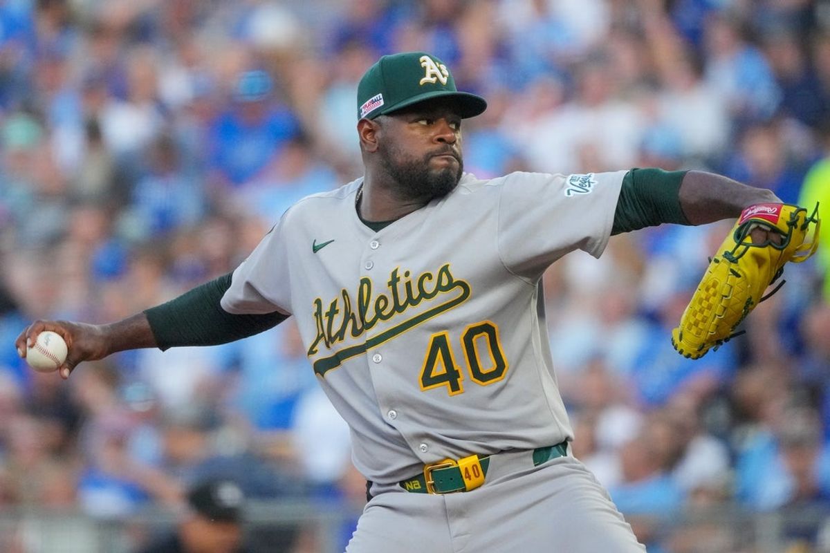 Jun 13, 2025; Kansas City, Missouri, USA; Athletics starting pitcher Luis Severino (40) delivers a pitch against the Kansas City Royals in the first inning at Kauffman Stadium. Mandatory Credit: Denny Medley-Imagn Images
