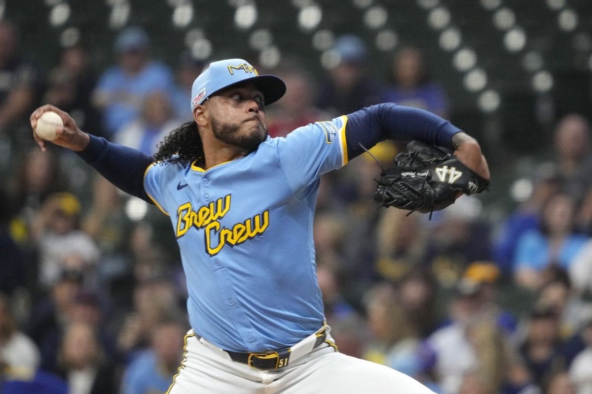 Jun 13, 2025; Milwaukee, Wisconsin, USA; Milwaukee Brewers pitcher Freddy Peralta (51) delivers a pitch against the St. Louis Cardinals in the first inning at American Family Field. Mandatory Credit: Michael McLoone-Imagn Images