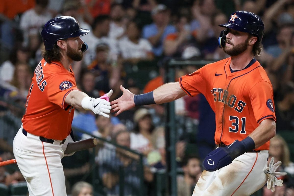 Jun 13, 2025; Houston, Texas, USA; Houston Astros second baseman Brendan Rodgers (1) celebrates  left fielder Jacob Melton (31) run agains the Minnesota Twins in the third inning at Daikin Park. Mandatory Credit: Thomas Shea-Imagn Images