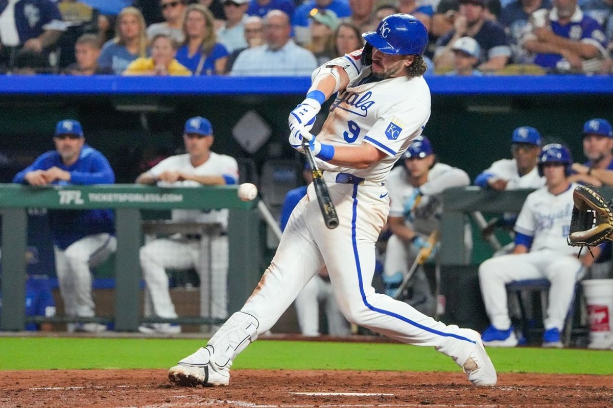Jun 13, 2025; Kansas City, Missouri, USA; Kansas City Royals first base Vinnie Pasquantino (9) hits a single against the Athletics in the sixth inning at Kauffman Stadium. Mandatory Credit: Denny Medley-Imagn Images