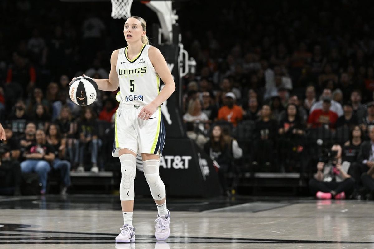 Jun 13, 2025; Las Vegas, Nevada, USA; Dallas Wings guard Paige Bueckers (5) dribbles the ball against the Las Vegas Aces in the fourth quarter of their game at Michelob Ultra Arena. Mandatory Credit: Candice Ward-Imagn Images