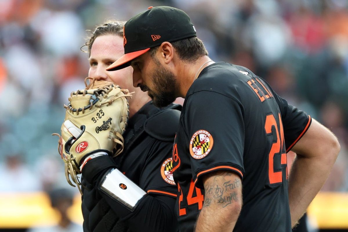 Jun 11, 2025; Baltimore, Maryland, USA; Baltimore Orioles pitcher Zach Eflin (24) speaks with Baltimore Orioles catcher Adley Rutschman (35) during the fifth inning against the Detroit Tigers at Oriole Park at Camden Yards. Mandatory Credit: Daniel Kucin Jr.-Imagn Images