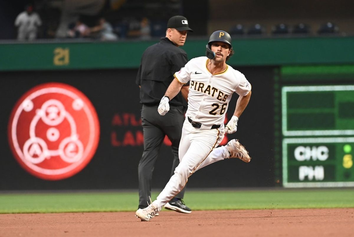 Jun 9, 2025; Pittsburgh, Pennsylvania, USA;  Adam Frazier of the Pittsburgh Pirates rounds second base against the Miami Marlins at PNC Park. Mandatory Credit: Philip G. Pavely-Imagn Images