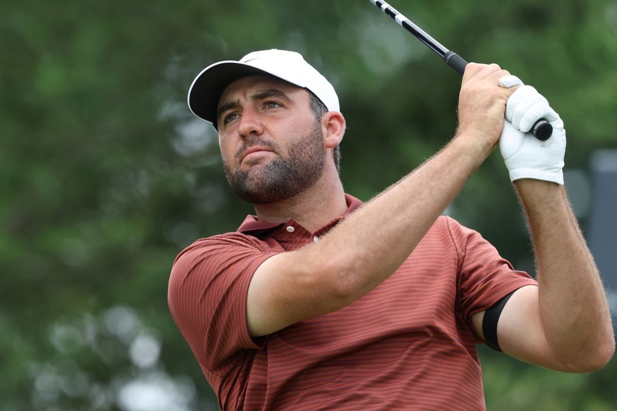 Jun 14, 2025; Oakmont, Pennsylvania, USA; Scottie Scheffler plays his shot from the first tee during the third round of the U.S. Open golf tournament. Mandatory Credit: Charles LeClaire-Imagn Images