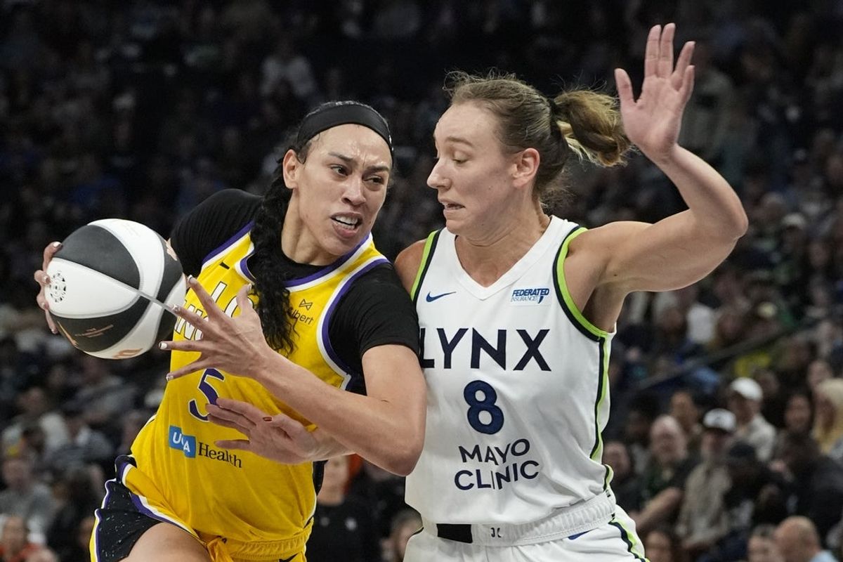 Jun 14, 2025; Minneapolis, Minnesota, USA; Los Angeles Sparks forward Dearica Hamby (5) goes to the basket against Minnesota Lynx forward Alanna Smith (8) in the second quarter at Target Center. Mandatory Credit: Bruce Kluckhohn-Imagn Images