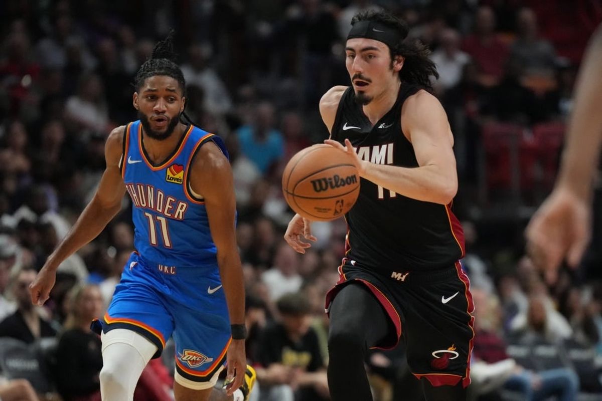 Jan 10, 2024; Miami, Florida, USA; Miami Heat guard Jaime Jaquez Jr. (11) brings the ball up the court against the Oklahoma City Thunder during the first half at Kaseya Center.