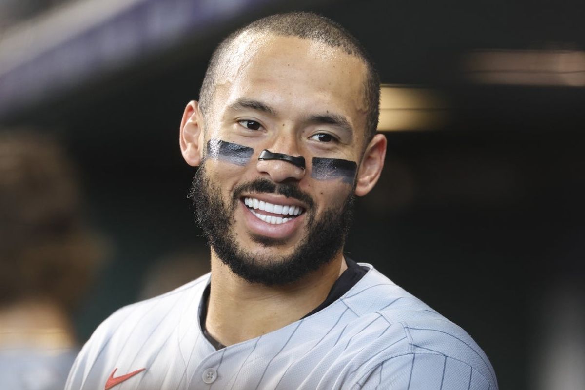 Jun 14, 2025; Houston, Texas, USA; Minnesota Twins shortstop Carlos Correa (4) smiles in the dugout before the third inning against the Houston Astros at Daikin Park. Mandatory Credit: Troy Taormina-Imagn Images
