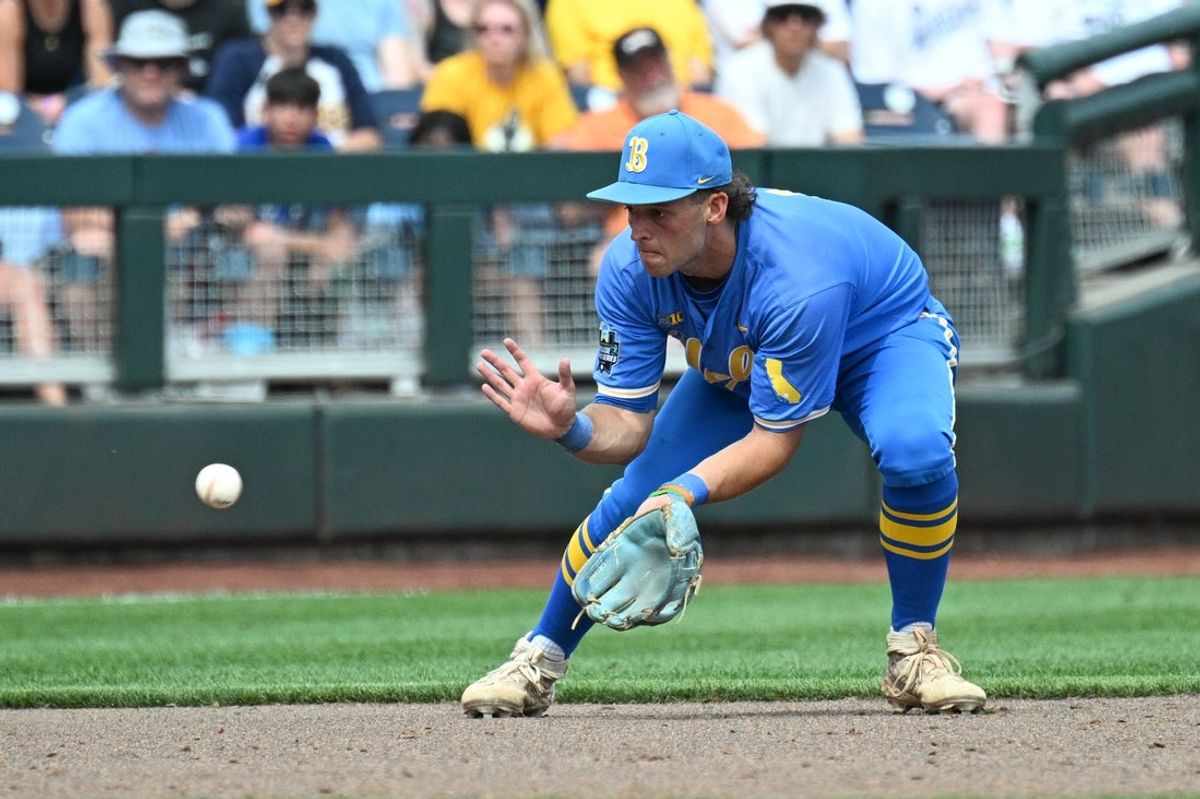 Jun 14, 2025; Omaha, Neb, USA;  UCLA Bruins shortstop Roch Cholowsky (1) fields a ground ball against the Murray State Racers during the ninth inning at Charles Schwab Field. Mandatory Credit: Steven Branscombe-Imagn Images