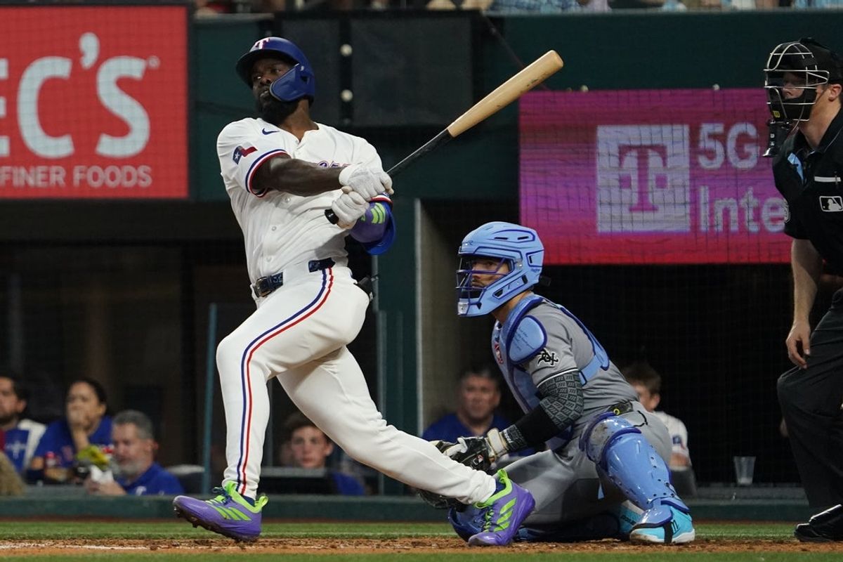 Jun 14, 2025; Arlington, Texas, USA; Texas Rangers outfielder Adolis García (53) hits a single during the sixth inning against the Chicago White Sox at Globe Life Field. Mandatory Credit: Raymond Carlin III-Imagn Images