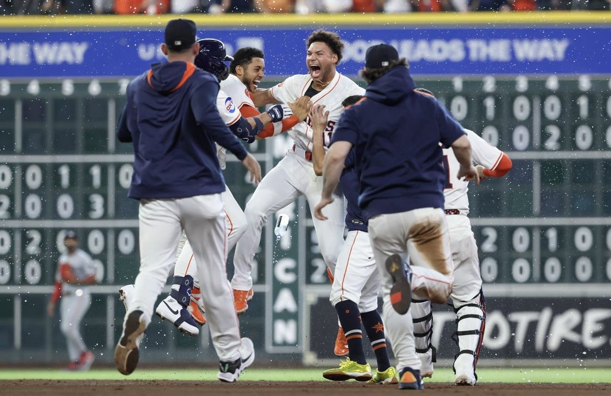 Jun 14, 2025; Houston, Texas, USA; Houston Astros right fielder Cam Smith (11) celebrates with teammates after hitting a walk-off RBI single during the ninth inning against the Minnesota Twins at Daikin Park. Mandatory Credit: Troy Taormina-Imagn Images