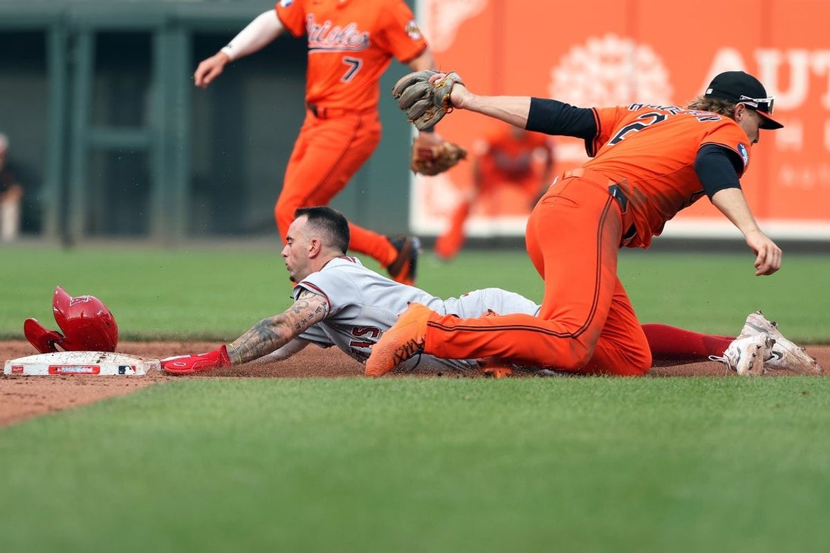 Jun 14, 2025; Baltimore, Maryland, USA; Los Angeles Angels shortstop Zach Neto (9) gets caught stealing second by Baltimore Orioles shortstop Gunnar Henderson (2) during the eighth inning at Oriole Park at Camden Yards. Mandatory Credit: Daniel Kucin Jr.-Imagn Images