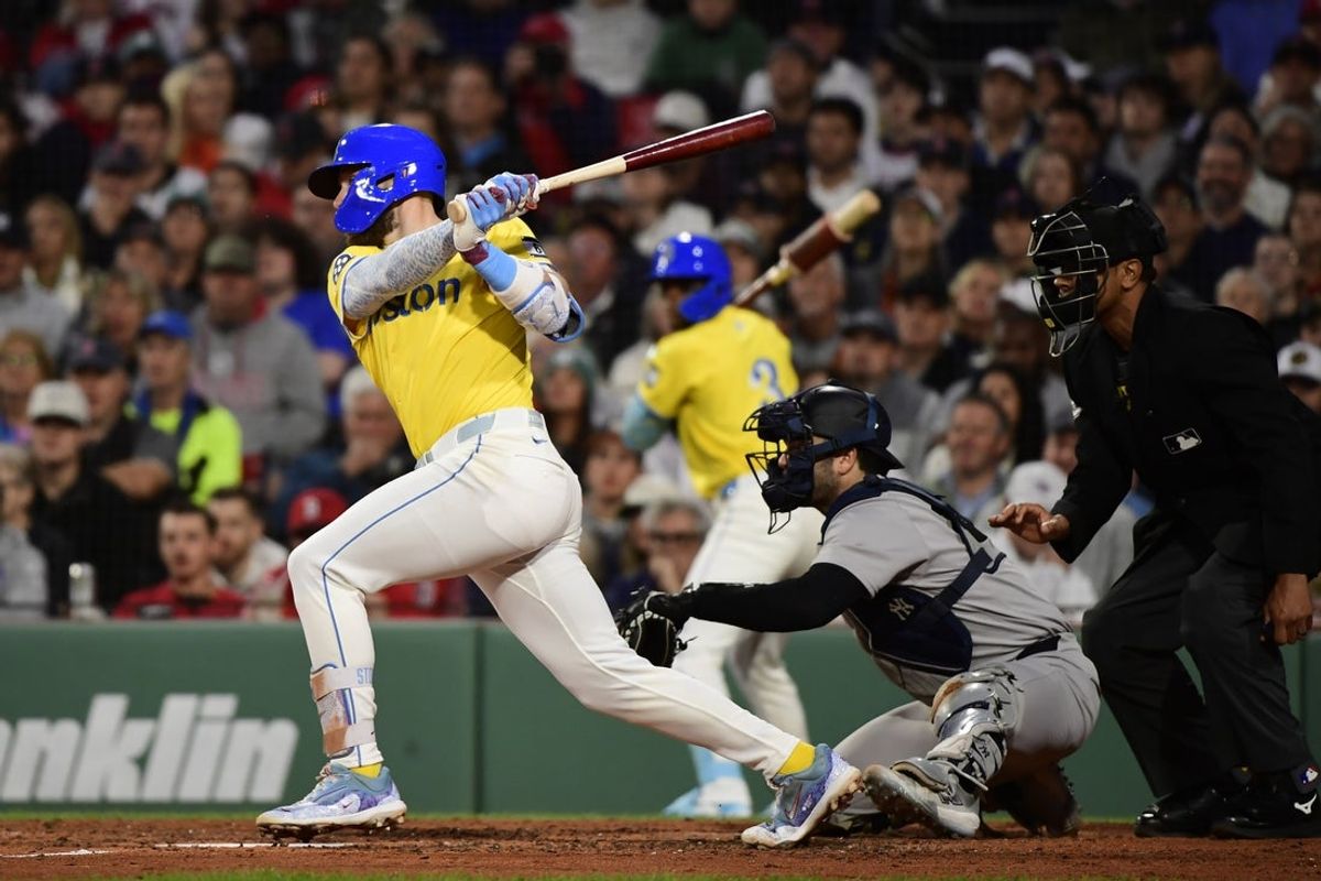 Jun 14, 2025; Boston, Massachusetts, USA; Boston Red Sox shortstop Trevor Story (10) hits an RBI double during the fourth inning against the New York Yankees at Fenway Park. Mandatory Credit: Bob DeChiara-Imagn Images