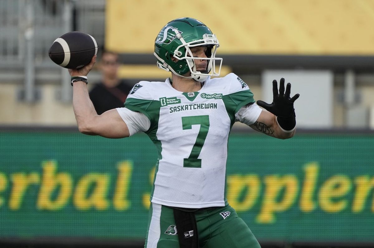 Jun 14, 2025; Hamilton, Ontario, Canada; Saskatchewan Roughriders quarterback Trevor Harris (7) throws a pass against the Hamilton Tiger-Cats during the first half at Hamilton Stadium. Mandatory Credit: John E. Sokolowski-Imagn Images