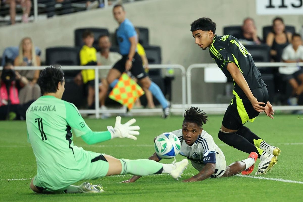 Jun 14, 2025; Columbus, Ohio, USA; Columbus Crew midfielder Taha Habroune (16) takes a shot on goal as Vancouver Whitecaps midfielder Ralph Priso (13) and goalkeeper Yohei Takaoka (1) save the ball during the second half at Lower.com Field. Mandatory Credit: Joseph Maiorana-Imagn Images