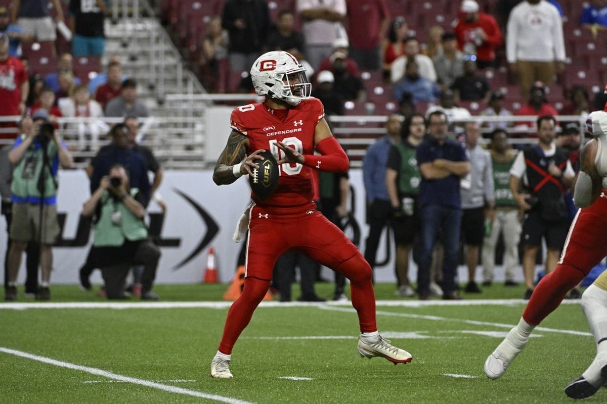 Jun 14, 2025; St. Louis, MO, USA; DC Defenders quarterback Jordan Ta'amu (10) looks to pass against the Michigan Panthers during the first quarter of the 2025 UFL Championship at The Dome at America’s Center. Mandatory Credit: Jeff Le-Imagn Images