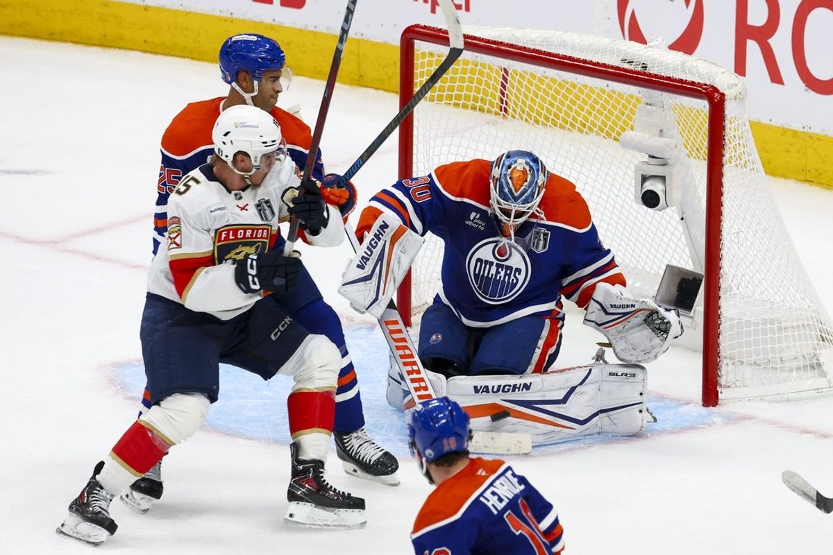 Jun 14, 2025; Edmonton, Alberta, CAN; Edmonton Oilers goaltender Calvin Pickard (30) defends against Florida Panthers forward Anton Lundell (15) during the third period in game five of the 2025 Stanley Cup Final at Rogers Place. Mandatory Credit: Sergei Belski-Imagn Images
