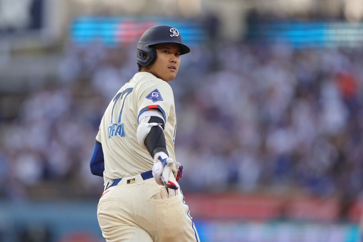 Jun 14, 2025; Los Angeles, California, USA; Los Angeles Dodgers two-way player Shohei Ohtani (17) reacts after hitting a lead-off home run against the San Francisco Giants at Dodger Stadium. Mandatory Credit: Ryan Sun-Imagn Images