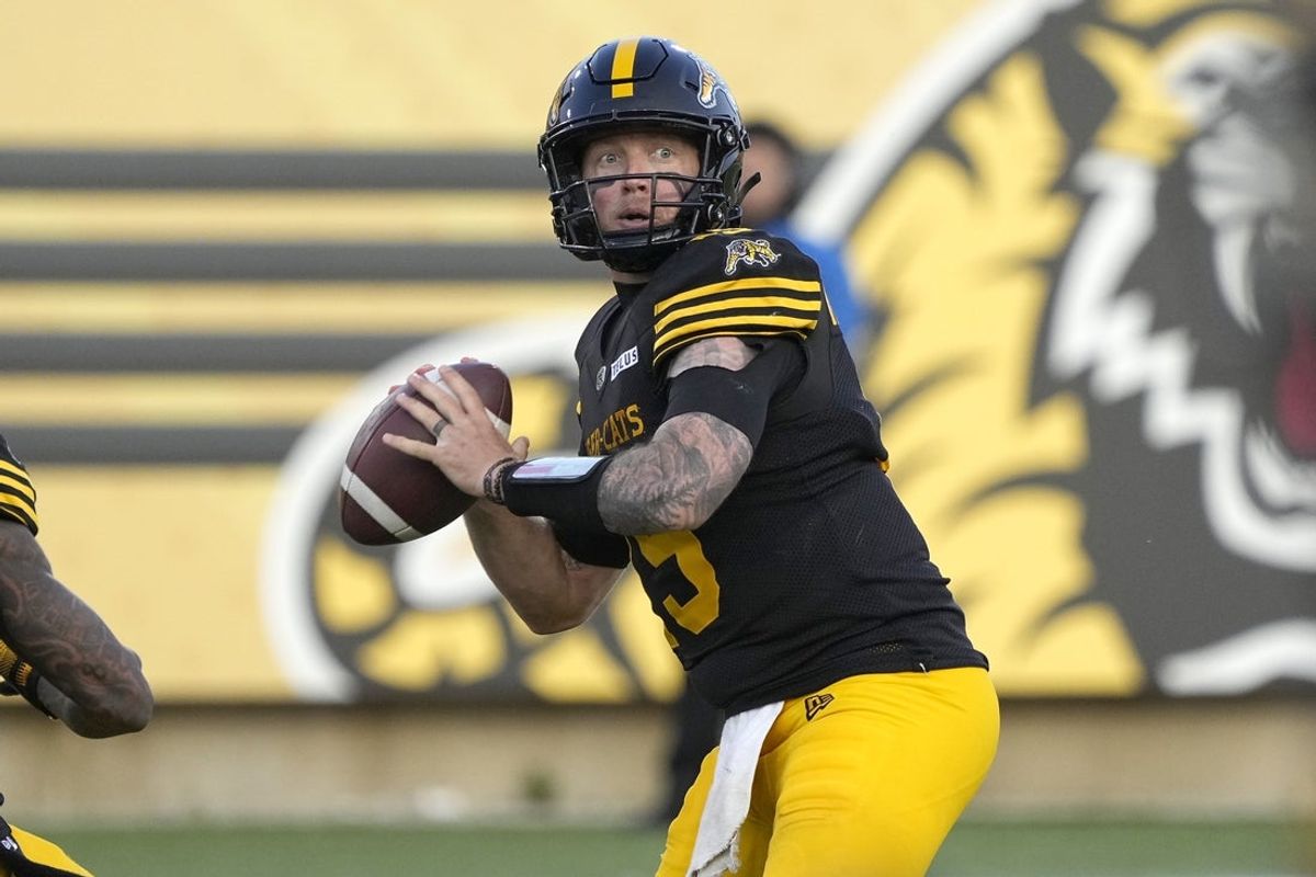 Jun 14, 2025; Hamilton, Ontario, Canada; Hamilton Tiger-Cats quarterback Bo Levi Mitchell (19) passes the football against the Saskatchewan Roughriders during the second half at Hamilton Stadium. Mandatory Credit: John E. Sokolowski-Imagn Images
