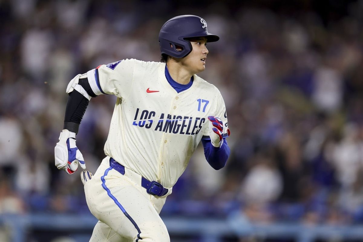 Jun 14, 2025; Los Angeles, California, USA;  Los Angeles Dodgers designated hitter Shohei Ohtani runs after hitting a solo home-run during the sixth inning of a baseball game against the San Francisco Giants at Dodger Stadium. Mandatory Credit: Ryan Sun-Imagn Images