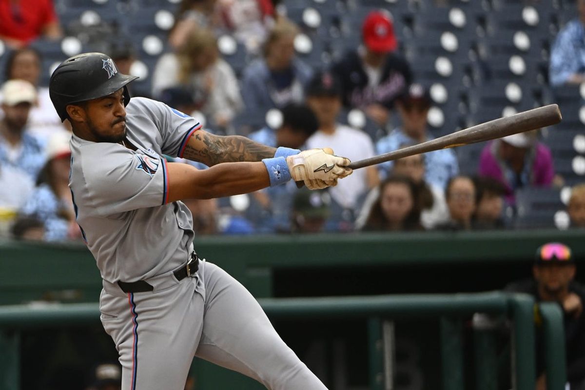 Jun 15, 2025; Washington, District of Columbia, USA; Miami Marlins center fielder Dane Myers (54) hits a solo home run against the Washington Nationals during the second inning at Nationals Park. Mandatory Credit: Brad Mills-Imagn Images