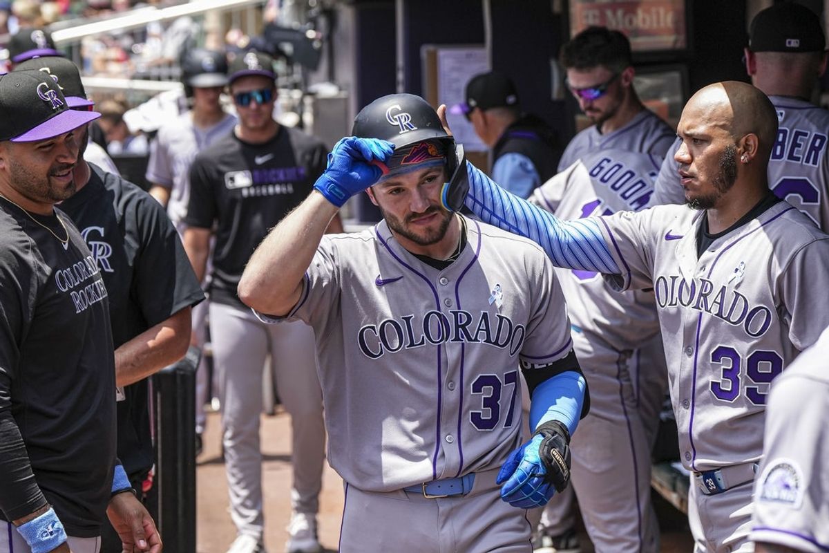 Jun 15, 2025; Cumberland, Georgia, USA; Colorado Rockies catcher Braxton Fulford (37) reacts in the dugout after hitting a sacrifice fly ball to drive in a run against the Atlanta Braves during the third inning at Truist Park. Mandatory Credit: Dale Zanine-Imagn Images