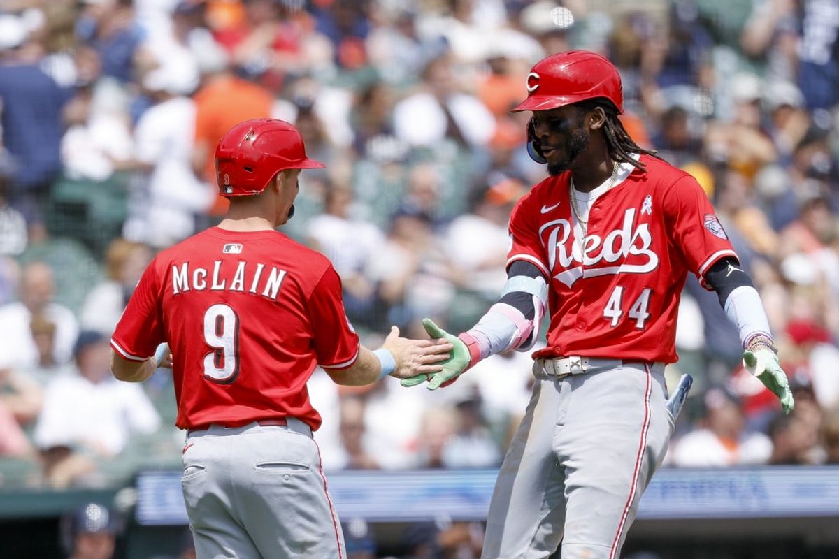 Jun 15, 2025; Detroit, Michigan, USA;  Cincinnati Reds designated hitter Elly De La Cruz (44) receives congratulations from second baseman Matt McLain (9)  after he hits a two run home run in the ninth inning against the Detroit Tigers at Comerica Park. Mandatory Credit: Rick Osentoski-Imagn Images
