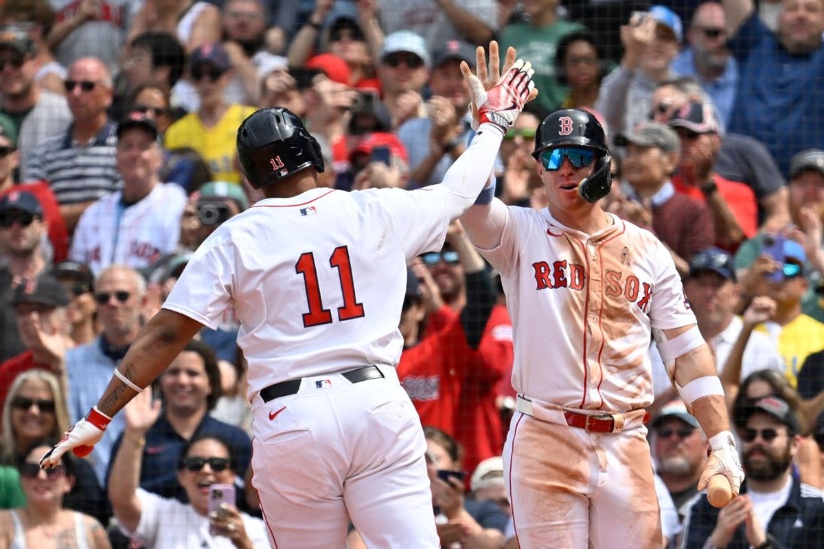 Jun 15, 2025; Boston, Massachusetts, USA; Boston Red Sox first baseman Romy Gonzalez (23) reacts to designated hitter Rafael Devers' (11) one run home run during the fifth inning against the New York Yankees at Fenway Park. Mandatory Credit: Eric Canha-Imagn Images