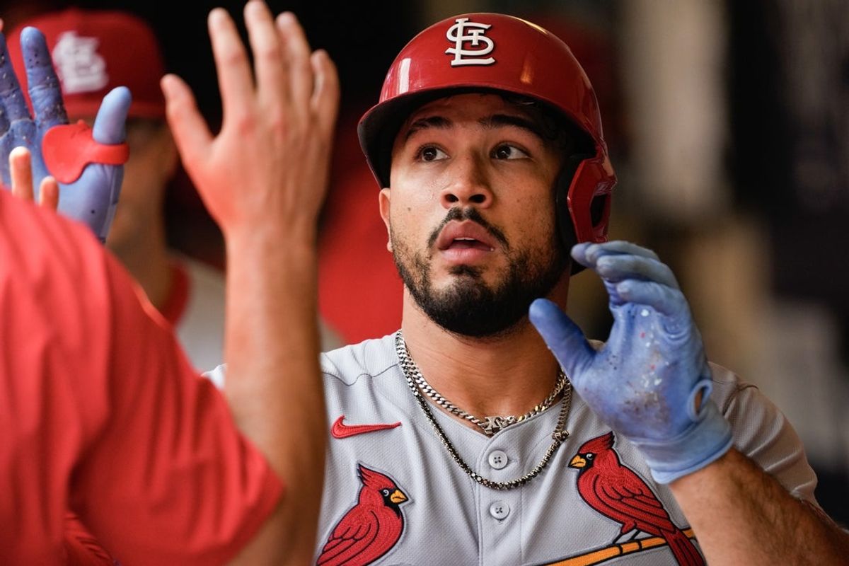 Jun 15, 2025; Milwaukee, Wisconsin, USA;  St. Louis Cardinals first baseman Alec Burleson (41) high-fives teammates after hitting a home run during the eighth inning against the Milwaukee Brewers at American Family Field. Mandatory Credit: Jeff Hanisch-Imagn Images