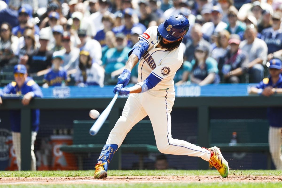 Jun 15, 2025; Seattle, Washington, USA; Seattle Mariners shortstop J.P. Crawford (3) hits a grand-slam home run Cleveland Guardians during the second inning at T-Mobile Park. Mandatory Credit: Joe Nicholson-Imagn Images