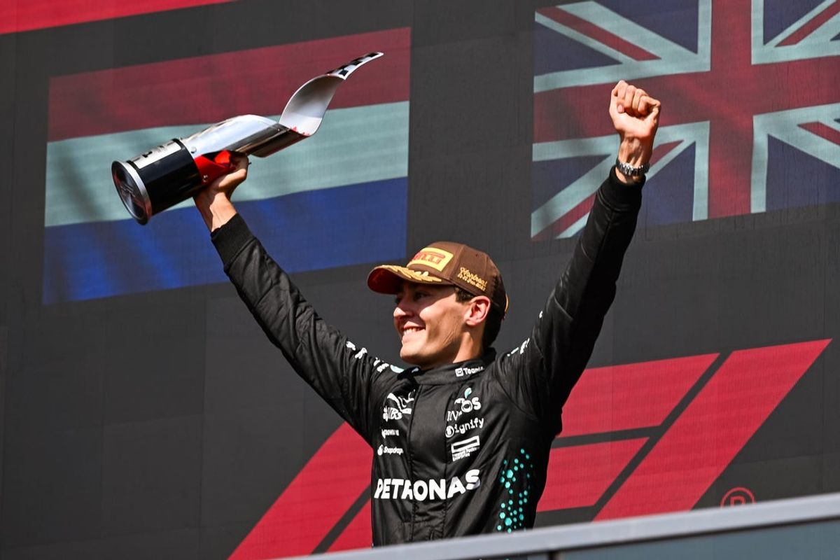 Jun 15, 2025; Montreal, Quebec, Canada; Winner of the F1 Canadian Grand Prix Mercedes driver George Russell (63) reacts after receiving his trophy at Circuit Gilles-Villeneuve. Mandatory Credit: David Kirouac-Imagn Images