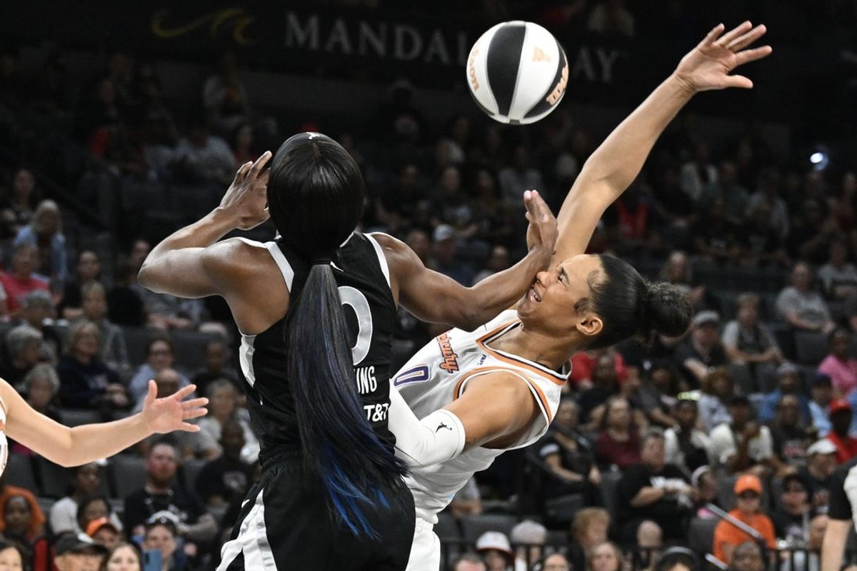 Jun 15, 2025; Las Vegas, Nevada, USA; Las Vegas Aces guard Jackie Young (0) collides with Phoenix Mercury forward Satou Sabally (0) in the first quarter at Michelob Ultra Arena. Mandatory Credit: Candice Ward-Imagn Images