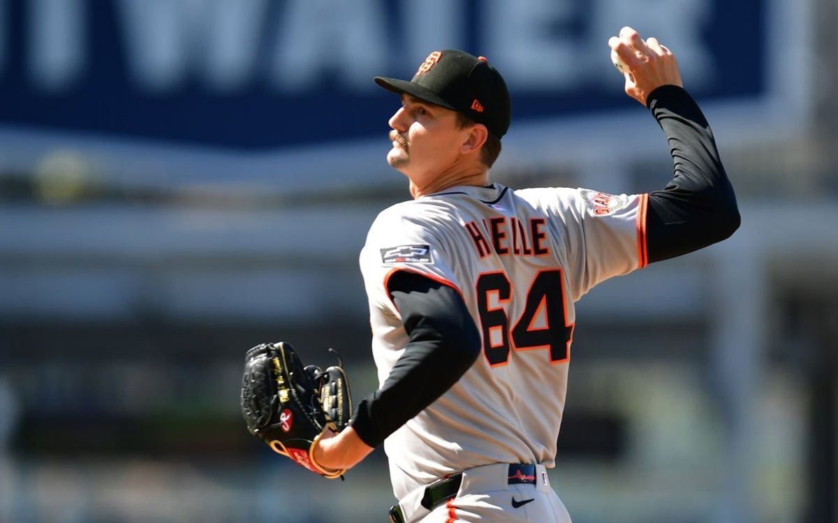 Jun 15, 2025; Los Angeles, California, USA; San Francisco Giants pitcher Sean Hjelle (64) throws during the first inning against the Los Angeles Dodgers at Dodger Stadium. Mandatory Credit: Gary A. Vasquez-Imagn Images