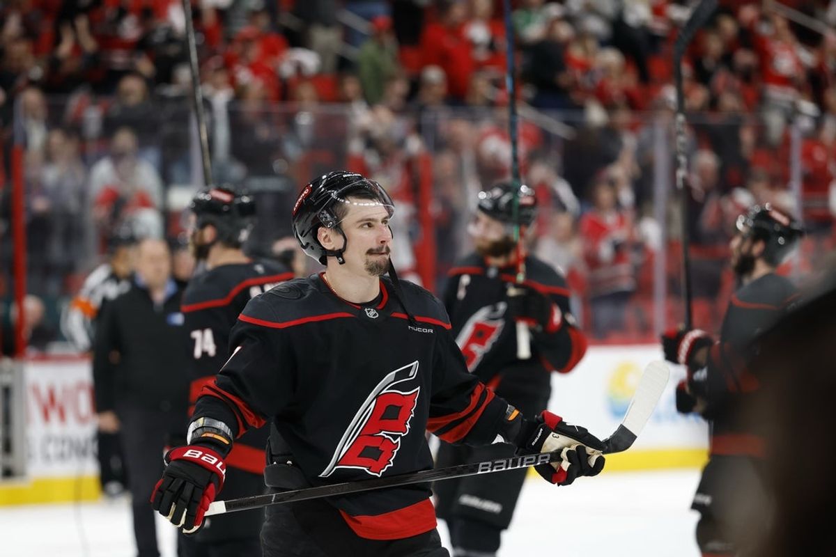 May 28, 2025; Raleigh, North Carolina, USA; Carolina Hurricanes defenseman Dmitry Orlov (7) stands with teammates on the ice after their game against the Florida Panthers in game five of the Eastern Conference Final of the 2025 Stanley Cup Playoffs at Lenovo Center. Mandatory Credit: Geoff Burke-Imagn Images