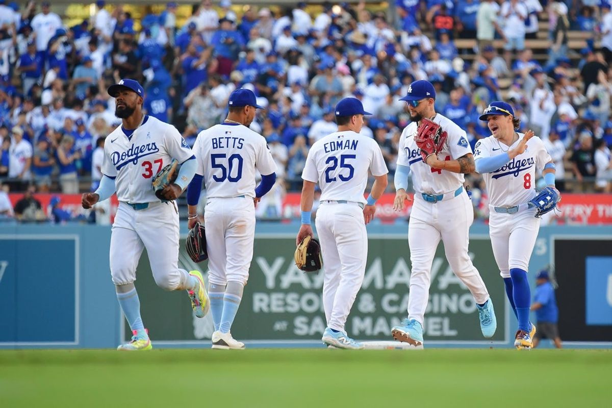 Jun 15, 2025; Los Angeles, California, USA; Los Angeles Dodgers right fielder Teoscar Hernandez (37) shortstop Mookie Betts (50) second baseman Tommy Edman (25) center fielder Andy Pages (44) and left fielder Enrique Hernández (8) celebrate the victory against the San Francisco Giants at Dodger Stadium. Mandatory Credit: Gary A. Vasquez-Imagn Images